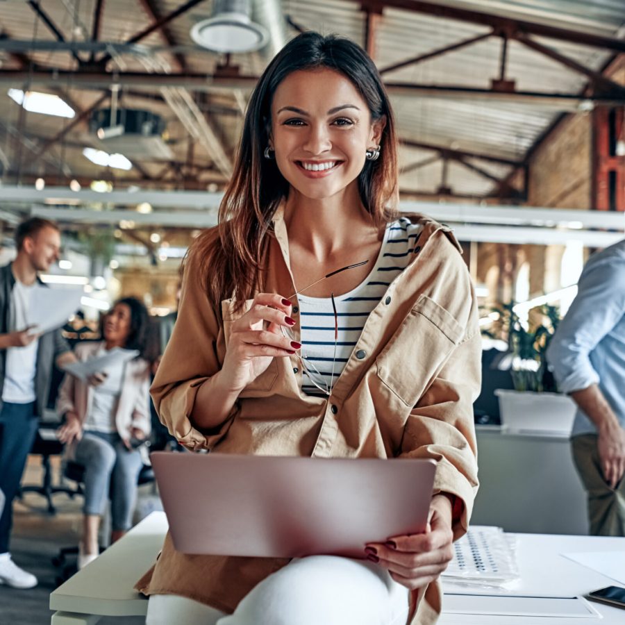 Group of young multiracial business people are working in modern office. Freelancers in coworking place. Creative and stylish youth.